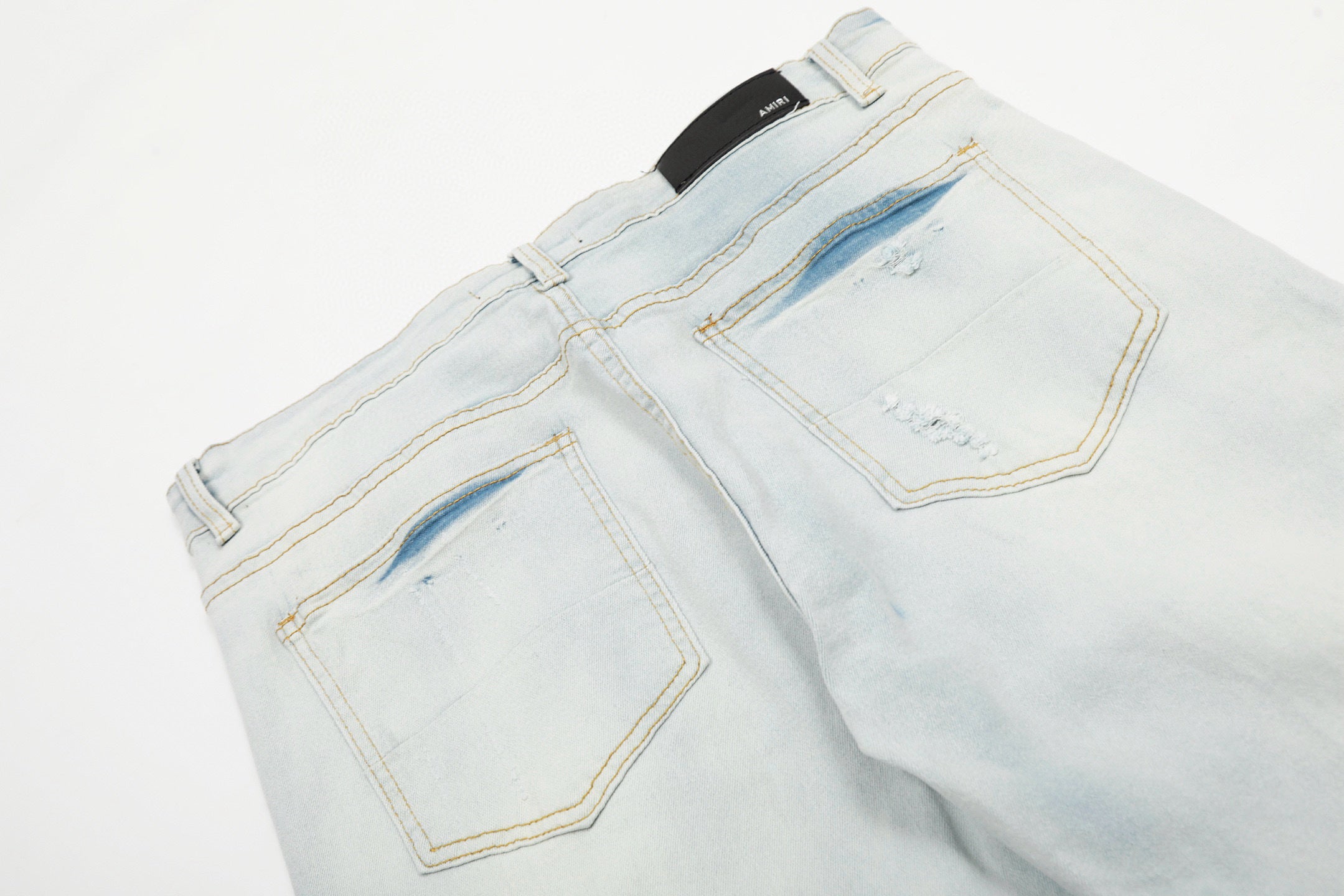Amiri | MX1 Leather Patch Distressed Jeans | Indigo