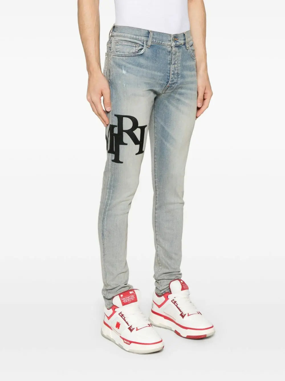 Amiri | Light Wash Staggered Logo Skinny Jeans | Antique Indigo Black Amiri