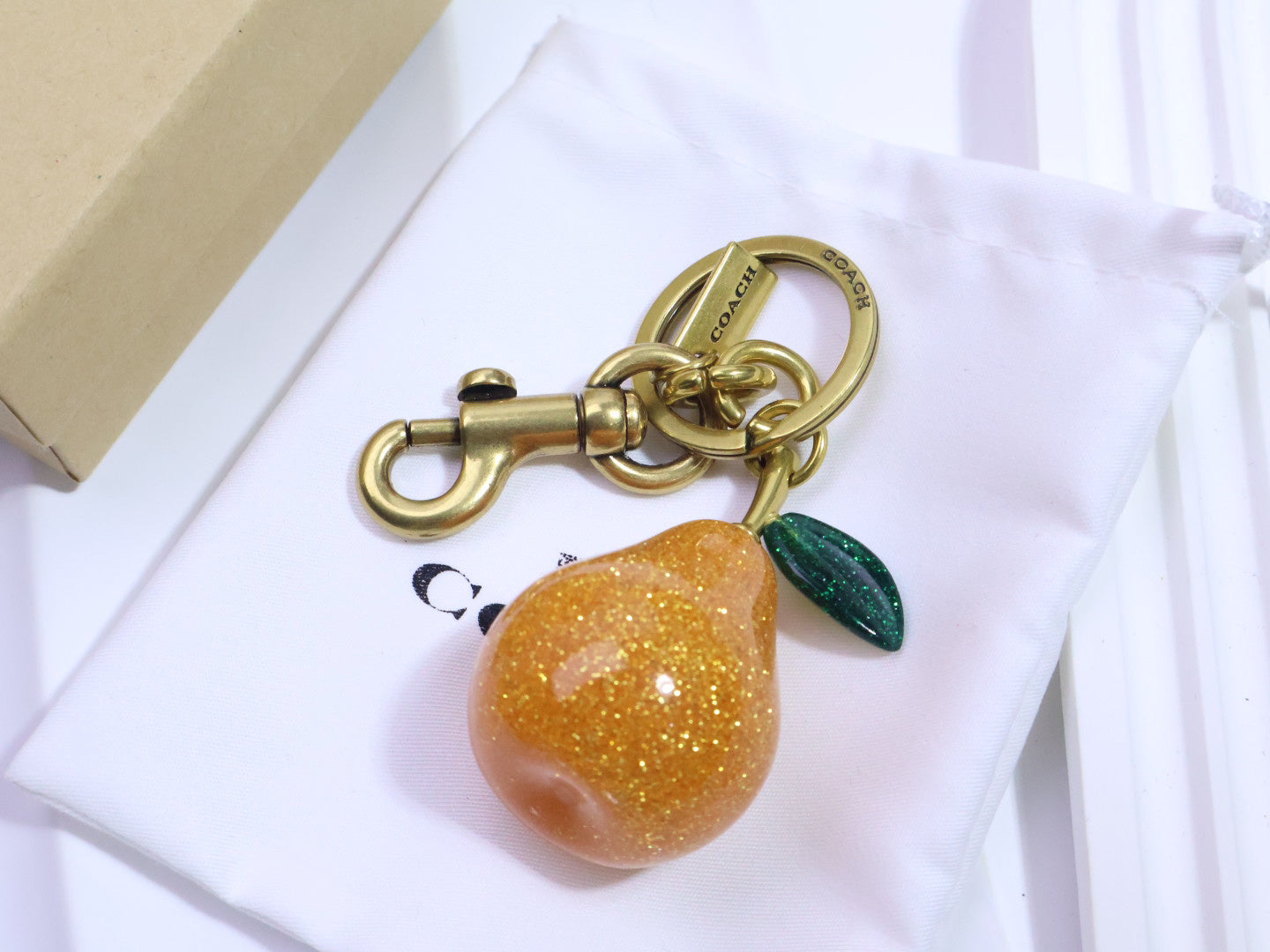 Coach | Glitter Pear Keychain | Orange