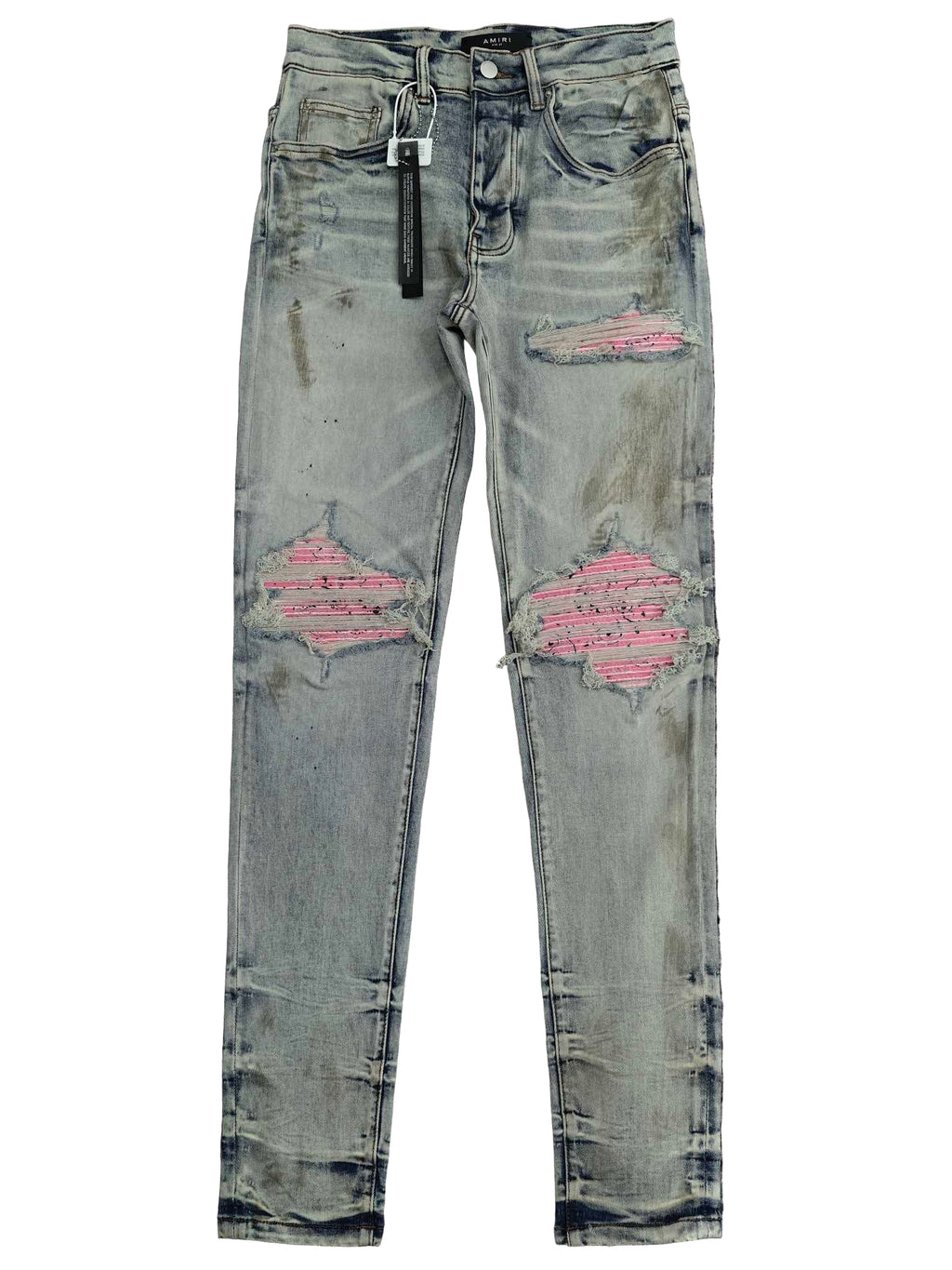 Distressed denim jeans with pink accents on a white background