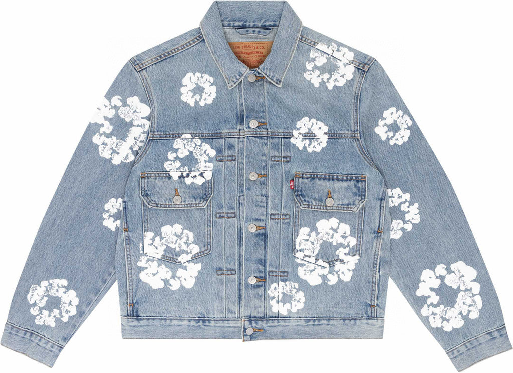 Denim jacket with white floral patterns on a white background