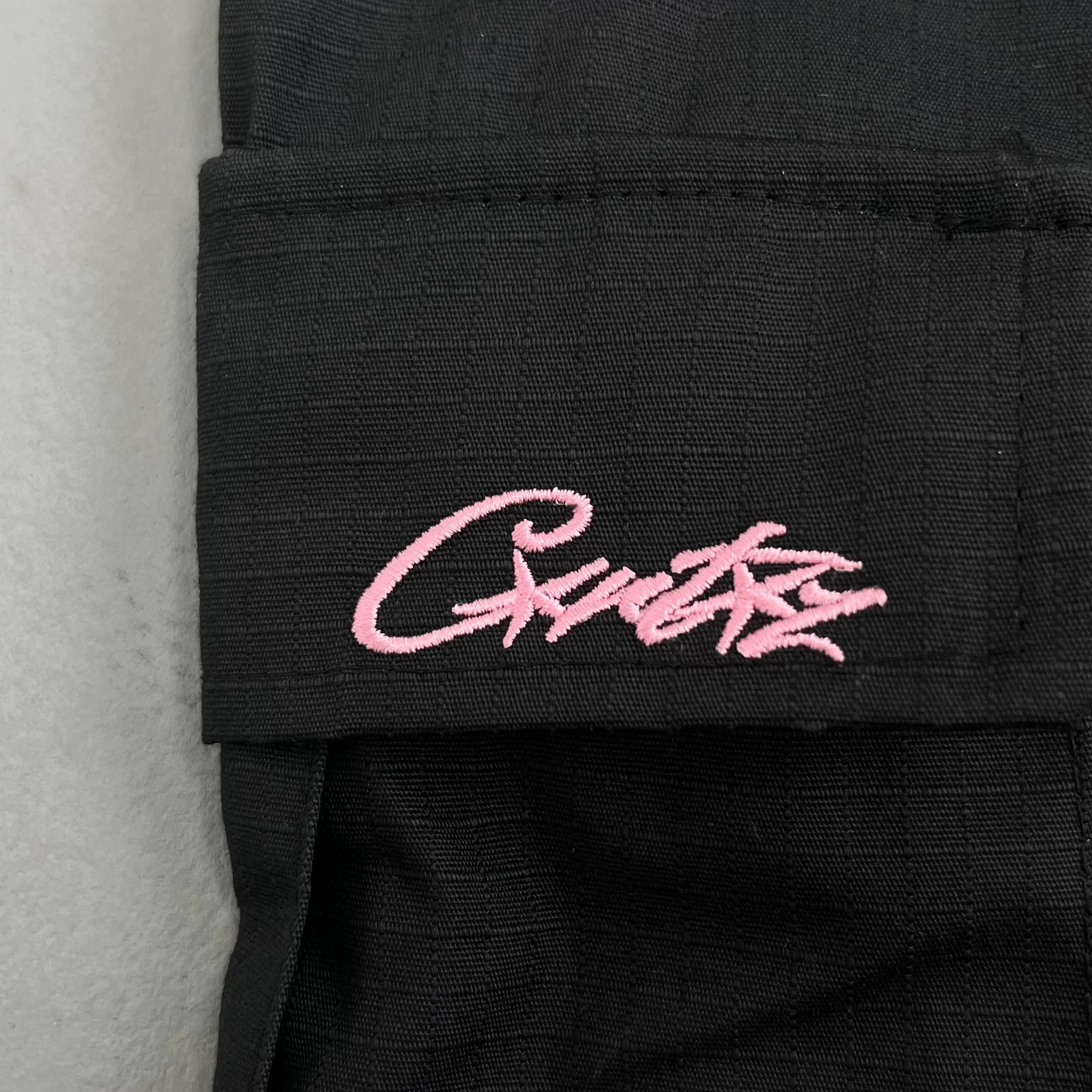 Corteiz | Black Cargo Pants with Purple or Pink Patch UndergroundDesignerPlug