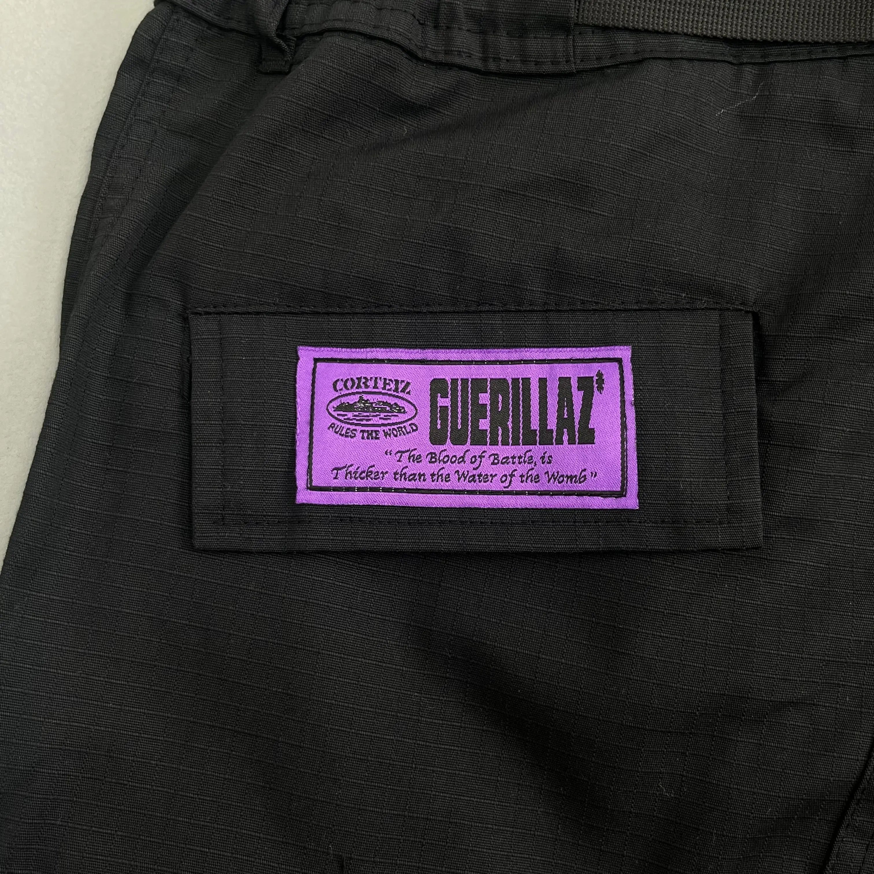 Corteiz | Black Cargo Pants with Purple or Pink Patch UndergroundDesignerPlug