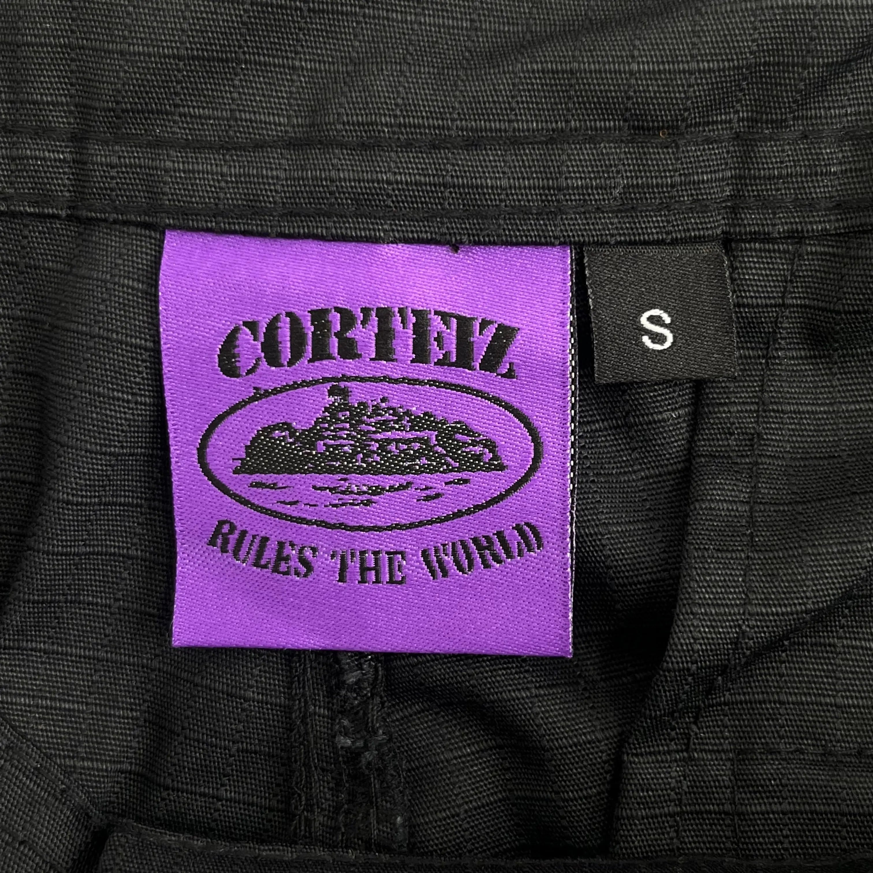 Corteiz | Black Cargo Pants with Purple or Pink Patch UndergroundDesignerPlug