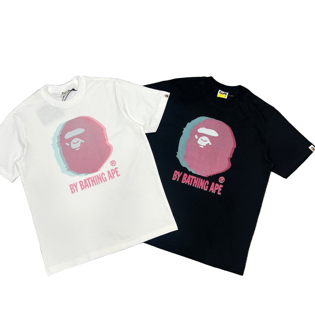 White and black t-shirts with 'By Bathing Ape' logo on a gray background