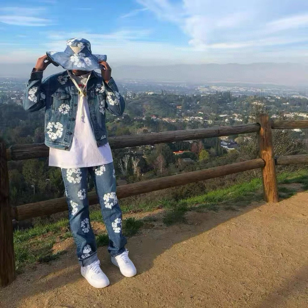 Person wearing a floral outfit with a scenic view in the background